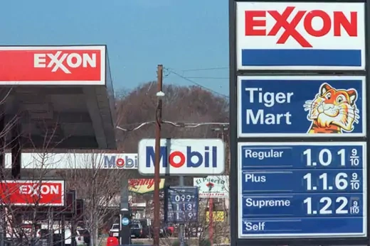 Exxon acquires Mobil for a record $80 billion in 1998, creating the world's largest oil company. Ira Schwarz/Courtesy Reuters