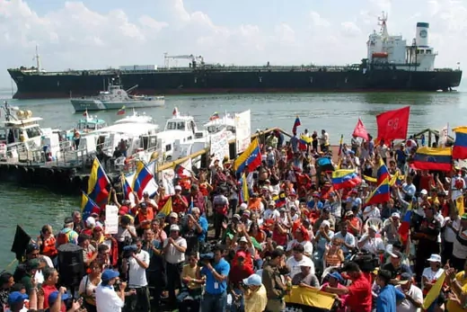 Striking PDVSA oil workers in front of an anchored oil ship. AP Images/Ana Maria Otero