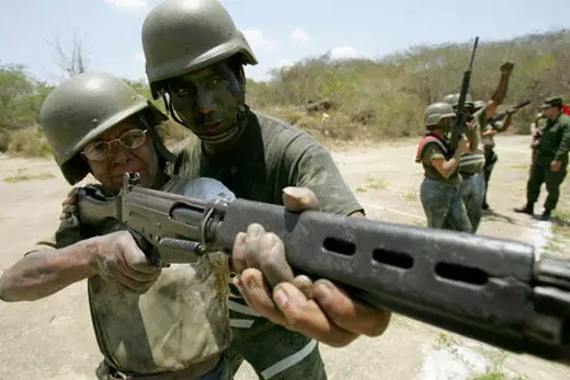 An army officer trains a civilian at a base outside Caracas. AP Images/Fernando Llano