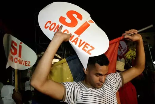 A Chávez supporter outside the Miraflores presidential palace in Caracas.  Daniel Aguilar/Reuters