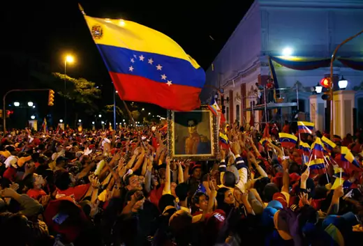 Chávez supporters mob the gate of Miraflores Palace in Caracas after the referendum to abolish term limits passes. Edwin Montilva/Reuters
