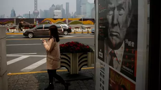 A Chinese magazine poster showing U.S. President Donald Trump is displayed at a newsstand in Shanghai, China on March 21, 2017. U.S. and Chinese citizens are anticipating a summit between Donald Trump and Xi Jinping this week.
