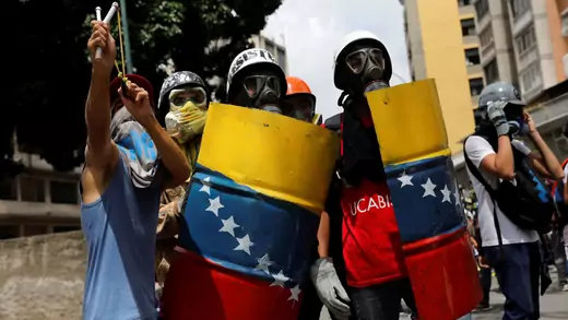 Venezuelan demonstrators clash with riot police during anti-Maduro protests in Caracas, Venezuela on May 24, 2017.