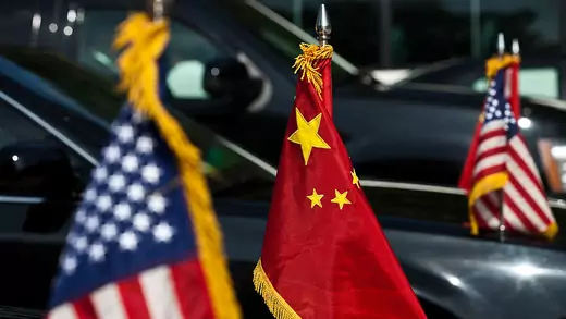 U.S. and China national flags adorn the motorcade of U.S. Vice President Joe Biden during a diplomatic visit to Beijing, China in 2011.