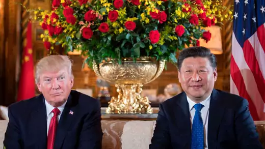 US President Donald Trump (L) sits with Chinese President Xi Jinping (R) during a bilateral meeting at the Mar-a-Lago estate in Florida.