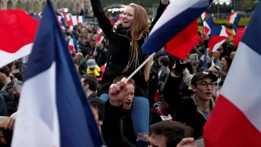 Supporters of Emmanuel Macron celebrate near the Louvre museum.