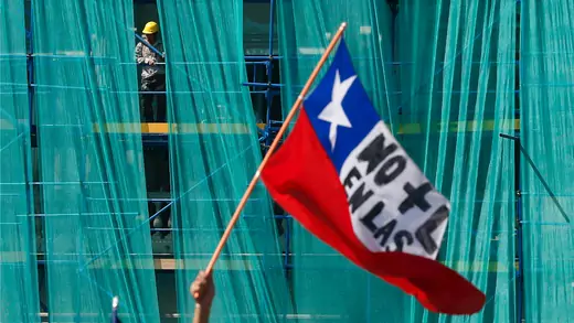 The words on the Chilean flag reads, "No more profit in the pension system" 