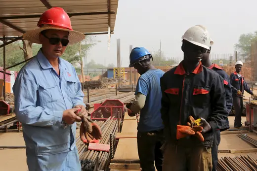 Chinese and Nigerien workers on a construction site in Niamey, Niger