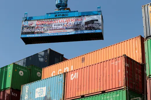 A container is loaded onto the first Chinese container ship leaving Gwadar port after its inauguration.