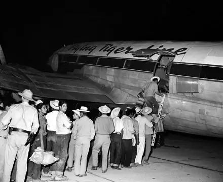 A group of illegal Mexican workers board a plane in California to be deported back to Mexico, 1951. AP