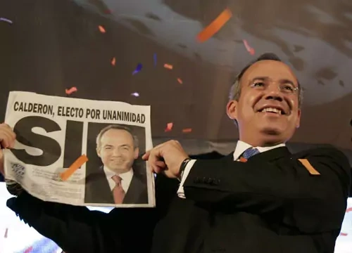 Mexican President Felipe Calderon celebrates his narrow victory. Gregory Bull/AP