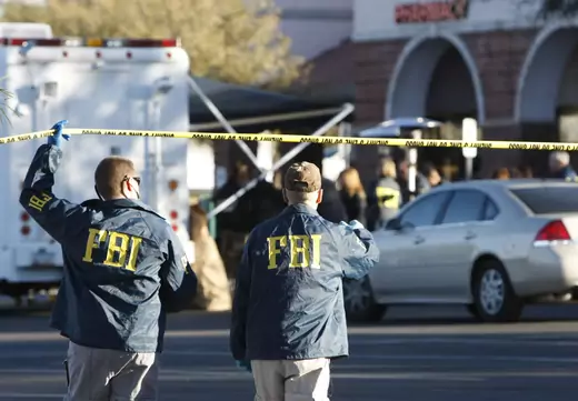 FBI agents respond to a crime scene. 