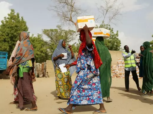 Women receive food aid in Nigeria.