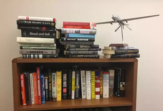 Bookshelf and model drone in Micah Zenko's office at the Council on Foreign Relations.