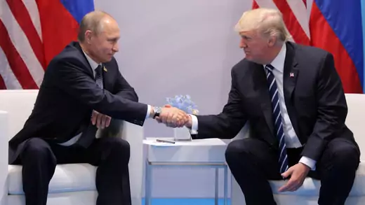 President Donald Trump shakes hands with Russia's President Vladimir Putin.