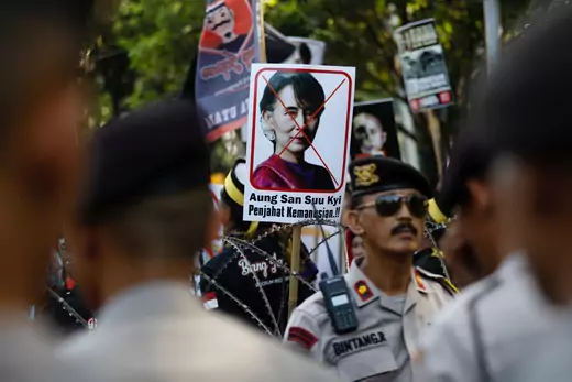 A placard with the picture of Aung San Suu Kyi, accusing her of crimes against humanity, is seen at a rally near the Myanmar embassy during a protest against the treatment of the Rohingya Muslims minority by the Myanmar government, in Jakarta, Indonesia September 8, 2017.