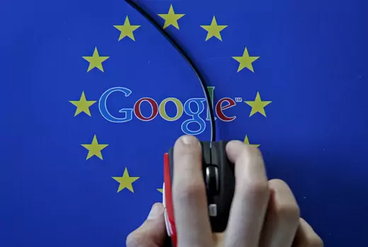 A woman hovers a mouse over the Google and European Union logos in this April 15, 2015 photo illustration. 