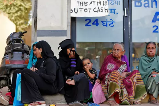 Indian Women Wait at Bank