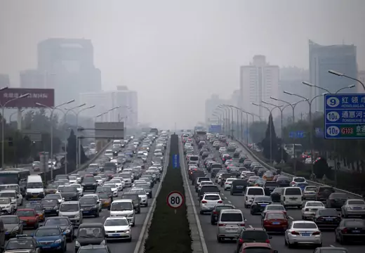 A view of traffic during a hazy day in Beijing, China, November 18, 2015. Some global automakers are worried that China is pushing its weight around as the world's biggest car market - by enforcing its own, often outdated, vehicle certification standards on foreign cars