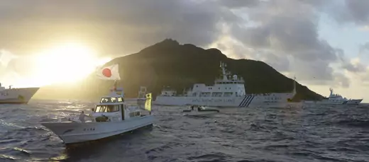 Chinese marine surveillance ship Haijian No. 51 sails near Japan Coast Guard vessels and a Japanese fishing boat in the East China Sea on July 1, 2013.