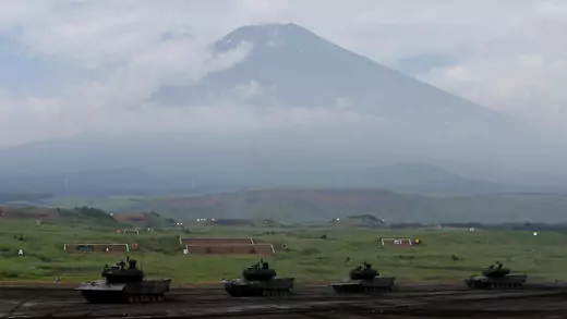 Japanese Ground Self-Defense Force tanks take part in an annual training session with Mount Fuji in the background at Higashifuji training field in Gotemba, west of Tokyo, Japan August 24, 2017