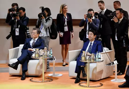 South Korea's President Moon Jae-in and Japan's Prime Minister Shinzo Abe sit at the start at the start of the "retreat meeting" on the first day of the G20 summit in Hamburg, Germany, July 7, 2017. 