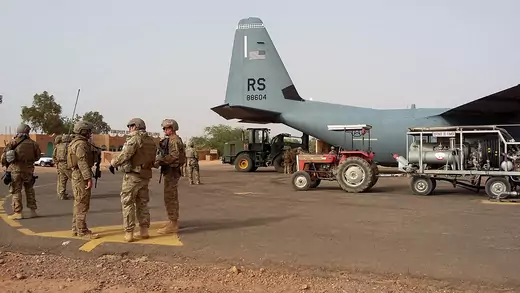 Airmen unload a C-130J Super Hercules during a deployment at Agadez, Niger.