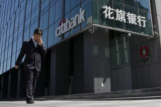 A man walks past a branch of Citibank in Beijing, on April 18, 2016. (Kim Kyung-Hoon/Reuters)
