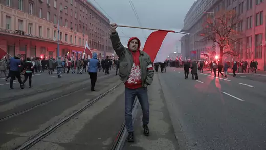 Protesters carry Polish flags during a rally, organized by nationalist groups, to mark the anniversary of Polish independence.
