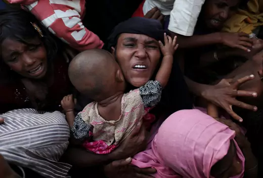 Rohingya refugees wait for aid near Cox’s Bazar, Bangladesh.