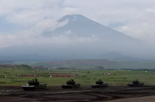 Japanese Ground Self-Defense Force tanks take part in an annual training session with Mount Fuji in the background at Higashifuji training field in Gotemba, Japan August 24, 2017.