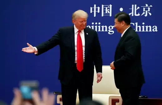 U.S. President Donald Trump and China's Xi Jinping meet business leaders at the Great Hall of the People in Beijing, China. November 9, 2017.