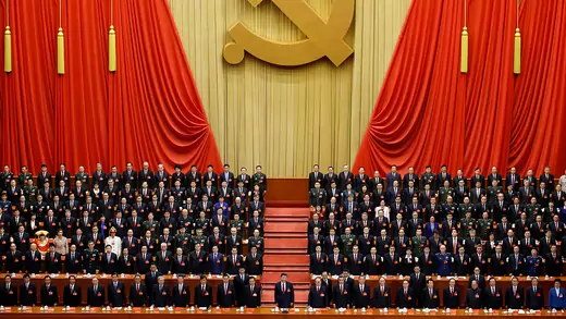 Xi Jinping stands before delegates at the closing session of the nineteenth National Congress of the Communist Party of China.
