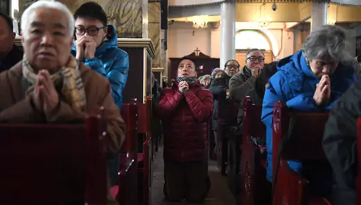 Chinese Catholics attend an Ash Wednesday mass at a state-sanctioned church in Beijing.