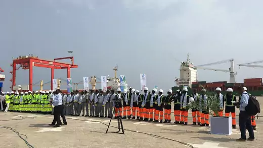 Djiboutian workers stand at the opening of the Doraleh Multipurpose Port