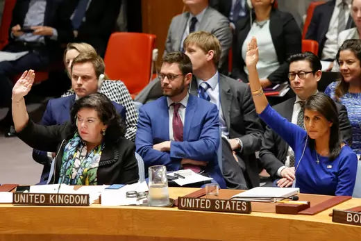 U.S. Ambassador Nikki Haley and UK Ambassador Karen Pierce vote against a Russian resolution condemning “aggression” against Syria during an emergency UN Security Council meeting.