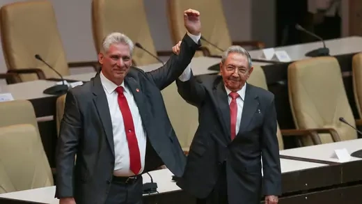 Former Cuban President Raul Castro celebrates with newly elected President Miguel Diaz-Canel at the National Assembly, April 19, 2018.