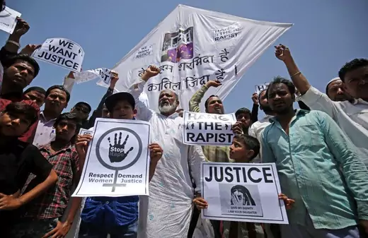 People hold placards at a protest against the rape of an eight-year-old girl in Kathua, in Ahmedabad, India.
