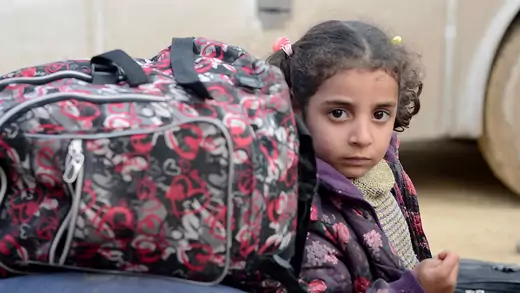 A girl evacuated from the Damascus suburb of Douma arrives in northern Syria.
