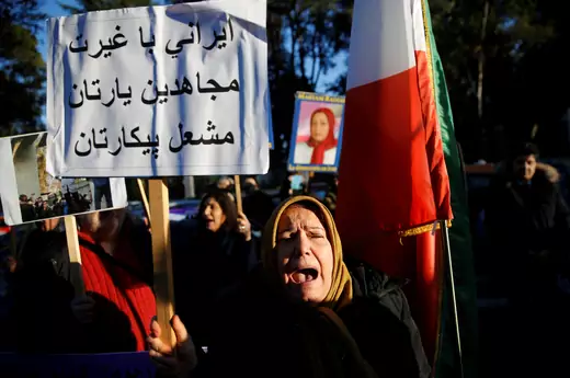 Opponents of Iranian President Hassan Rouhani hold a protest outside the Iranian embassy in Rome, Italy, on January 2, 2018.
