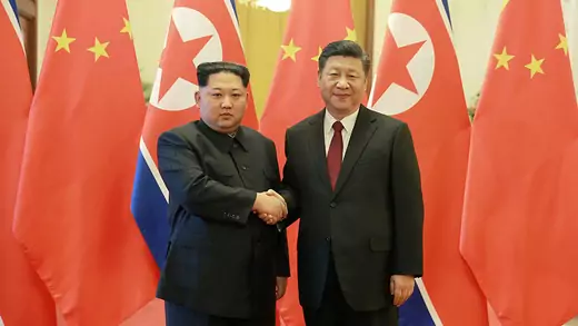 North Korean leader Kim Jong Un shakes hands with Chinese President Xi Jinping 