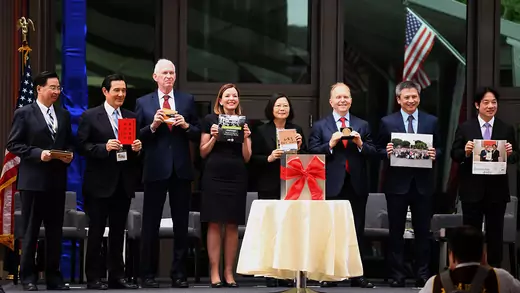 Representatives of Taiwan and the United States place items in a time capsule at the dedication ceremony of the new American Institute in Taiwan complex in Taipei. 