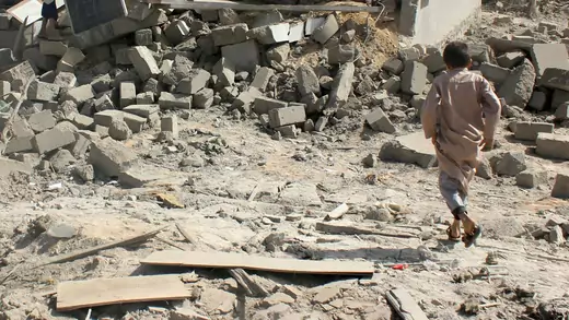 Child at site of air strike in Saada, Yemen