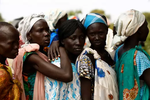 Women wait in line at a mobile health clinic in the village of Rubkuai, South Sudan.
