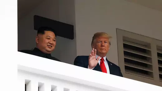 U.S. President Donald Trump and North Korean leader Kim Jong Un react at the Capella Hotel on Sentosa island in Singapore, June 12, 2018. 