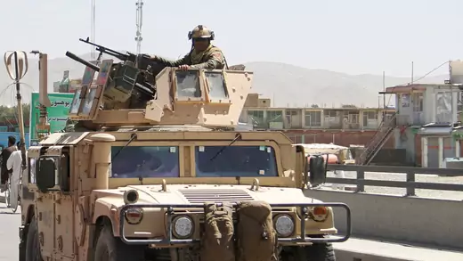 An Afghan security forces convoy patrol after a Taliban attack in Ghazni city, Afghanistan.