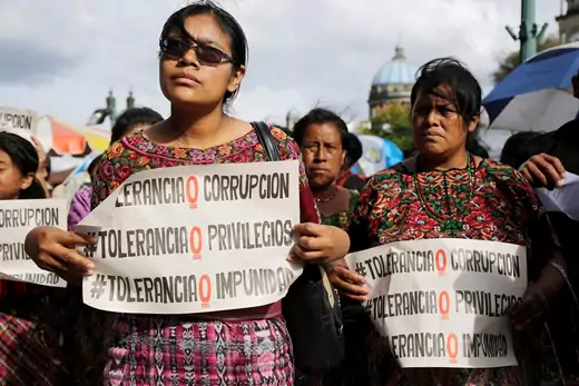 Indigenous women protest in front of the National Palace in Guatemala City, Guatemala. The signs read, "Tolerance 0 Corruption. Tolerance 0 privileges. Tolerance 0 Impunity"