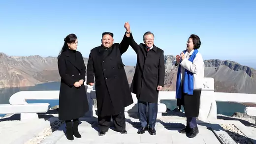 South Korean President Moon Jae-in and North Korean leader Kim Jong-un pose for photographs on the top of Mt. Paektu, North Korea.