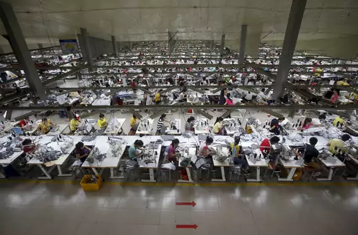 Labourers work at a garment factory in Bac Giang province, near Hanoi October 21, 2015.
