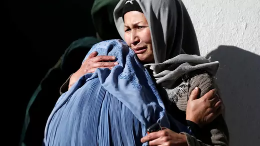 Afghan women mourn inside a hospital compound after a suicide attack in Kabul, Afghanistan.